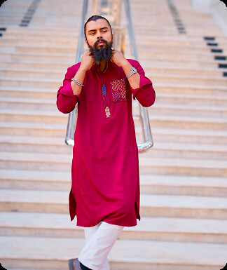 Back view of a model in a green traditional dress